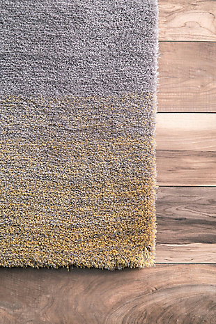 At nuLoom, we believe that floor coverings and art should not be mutually exclusive. Founded with a desire to break the rules of what is expected from an area rug, nuLoom was created to fill the void between brilliant design and affordability.100% polyester | Hand tufted | Easy to clean and maintain | Unique hand crafted piece | Spot clean recommended | Imported