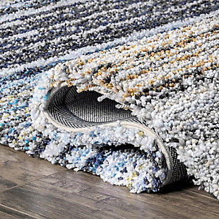 Sink your feet into comfort with the thick, wonderfully dense pile of this rug. Its modern design coordinates well with contemporary decor.100% polyester | Hand tufted | Easy to clean and maintain | Unique hand crafted piece | Spot clean recommended | Imported