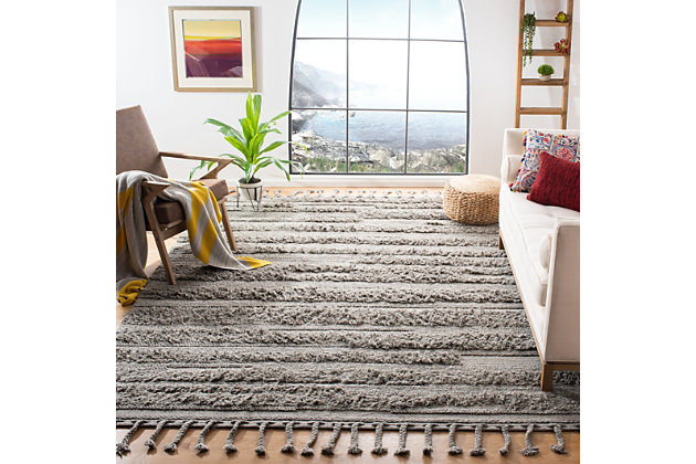 The Casablanca Collection of fine shag and flokati rugs displays the organic simplicity and classic style of traditional Moroccan rug weavers. These plush, luxurious area rugs are timeless yet contemporary. Casablanca is hand-tufted using the finest New Zealand wool to create the natural fleece tones and clean designs reminiscent of  the organic simplicity of Moroccan rug artistry. Construction: Hand Woven | Fiber Content: 100% Wool | Country of Origin: India