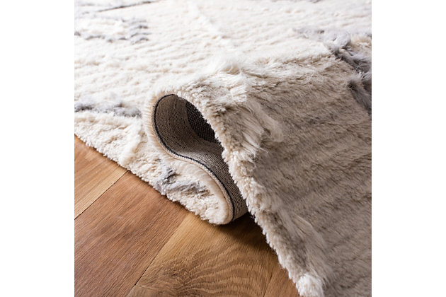 The Casablanca Collection of fine shag and flokati rugs displays the organic simplicity and classic style of traditional Moroccan rug weavers. These plush, luxurious area rugs are timeless yet contemporary. Casablanca is hand-tufted using the finest New Zealand wool to create the natural fleece tones and clean designs reminiscent of  the organic simplicity of Moroccan rug artistry. Construction: hand tufted | Fiber content: 100% wool | Country of origin: india
