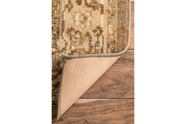 Reminiscent of classic Persian artistry, this printed rug is subtly distressed to mimic a timeworn look. Liven up a neutral living room with this richly toned rug and a few well-placed plants.100% nylon | Machine made | Easy to clean and maintain | Spot clean recommended | Imported