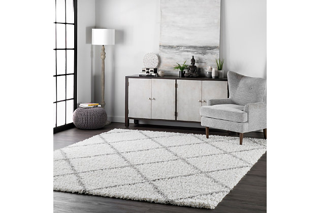 Create a comfortably textured foundation with this cozy shag rug. Each piece is Machine made of plush polypropylene fibers with simple yet chic geometric patterns, so you don’t have to sacrifice design for durability and ease of care.100% polypropylene | Machine made | Easy to clean and maintain | Spot clean recommended | Imported