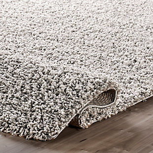 Indulge in the soft, plush feel of this cozy shag rug. The contemporary elements are designed to pull the various components of your room together effortlessly.100% polypropylene | Machine made | Easy to clean and maintain | Spot clean recommended | Imported
