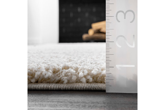 Indulge in the soft, plush feel of this cozy shag rug. The contemporary elements are designed to pull the various components of your room together effortlessly.100% polypropylene | Machine made | Easy to clean and maintain | Spot clean recommended | Imported | Imported