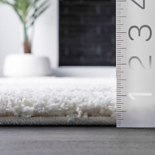 Indulge in the soft, plush feel of this cozy shag rug. The contemporary elements are designed to pull the various components of your room together effortlessly.100% polypropylene | Machine made | Easy to clean and maintain | Spot clean recommended | Imported | Imported