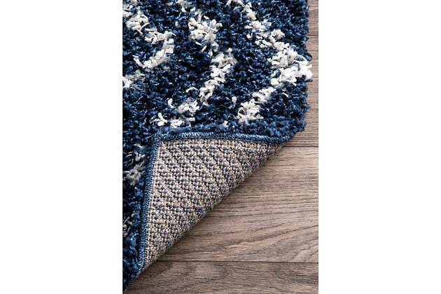 Indulge in the soft, plush feel of this cozy shag rug. The contemporary elements are designed to pull the various components of your room together effortlessly.100% polypropylene | Machine made | Easy to clean and maintain | Spot clean recommended | Imported