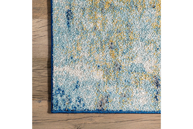 The creative use of abstract motifs in a blend of harmonious colors makes this rug a staple of modern design. Use it as a foundation for your contemporary style by incorporating blue or brown accent pieces to complement your rug.100% polypropylene | Machine made | Easy to clean and maintain | Spot clean recommended | Imported