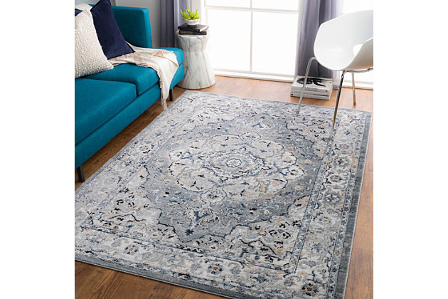 Charm your guests with the floral, lightly-distressed patterns of this elegant rug. Woven in Turkey? Its stunning design infuses traditional style with trendy cool-toned shades an? Its durability makes it perfect for an entry way, bedroom, living room or any other space in your home.Machine Woven | 90% Polypropylene, 10% Polyester | Easy Care | No Shedding | Imported