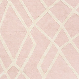 Ready for some out of line style? This Safavieh kids rug gives it to you with a fun, zig-zaggy pattern. Ultra precious pink and ivory colors are understated enough to grow with your child. And with premium, hand-tufted wool, this rug will bring lasting quality to your mini-me’s room.Made of wool | Hand-tufted | Rug pad recommended | Wool fibers are prone to shedding, vacuum regularly and shedding will subside | Imported | Spot clean/dry clean recommended