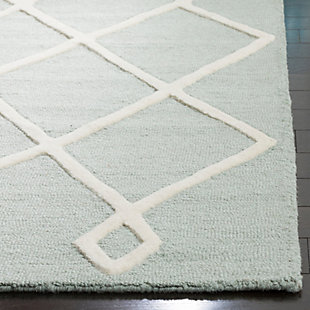 This Safavieh kids rugs is full of minty green freshness. Elevated ivory geometric pattern makes for transitional style that sticks with your child from the early years on. Rest assured the soft wool pile is hand-tufted for long-lasting quality.Made of wool | Hand-tufted | Rug pad recommended | Wool fibers are prone to shedding, vacuum regularly and shedding will subside | Imported | Spot clean/dry clean recommended