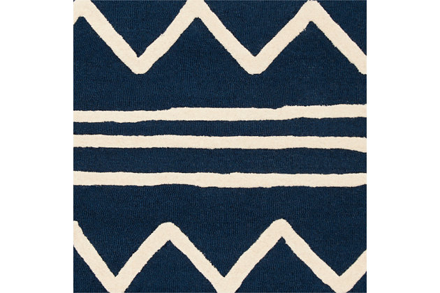 An inspired choice in sophisticated kids room style, this Safavieh hand-tufted wool rug walks the line between childlike drawing and work of art. Its ultra plush pile is quality crafted and made for years of enjoyment.Made of wool | Hand-tufted, high-low pile | Rug pad recommended | Wool fibers are prone to shedding, vacuum regularly and shedding will subside | Imported | Spot clean/dry clean recommended