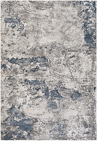 The cool tones of this piece blend perfectly together into a stunning pattern and the unique high-low textured pile brings luxurious, yet affordable, style to your floors. Turkish made and utilizing a blend of polyester and polypropylene for added softness, the grandiose design will instantly become the centerpiece of the room. Maintaining a flawless fusion of style and durability, this piece is a prime example of impeccable artistry and design. Machine Woven | 71% Polypropylene, 29% Polyester | High/Low Textured Pile | Easy Care | Imported