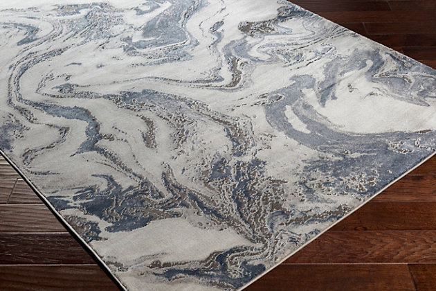 The cool tones of this piece blend perfectly together into a stunning pattern and the unique high-low textured pile brings luxurious, yet affordable, style to your floors. Turkish made and utilizing a blend of polyester and polypropylene for added softness, the grandiose design will instantly become the centerpiece of the room. Maintaining a flawless fusion of style and durability, this piece is a prime example of impeccable artistry and design. Machine Woven | 88% Polypropylene, 12% Polyester | High/Low Textured Pile | Easy Care | Imported