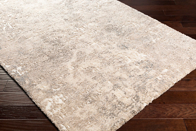 Introduce the soft, plush textures of this rug into your home and transform it into ultimate cozy space. The on trend abstract pattern that features a high-low pile detail for added depth, will instantly bring a modern feel and cotemporary vibe any decor. Great for a bedroom, living room, loft, or anywhere you want to add style and comfort. Made with a blend of polypropylene and polyester in Turkey, this rug is durable, plush and the perfect addition to your floors.Machine Woven | 91% Polypropylene, 9% Polyester | High/Low Textured Pile | Easy Care | Imported