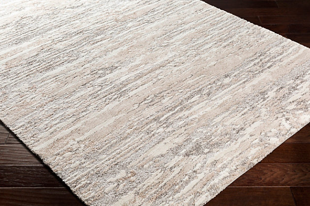 With a soft feel and stunning design, this rug will be the highlight of any room. Its abstract pattern is woven together by neutral yet impactful colors and features textured pile giving it depth. Woven in Turkey with polypropylene, this plush, cozy piece will bring both glamour and comfortable warmth to your floors.Machine Woven | 100% Polypropylene | Easy Care | No Shedding | Imported
