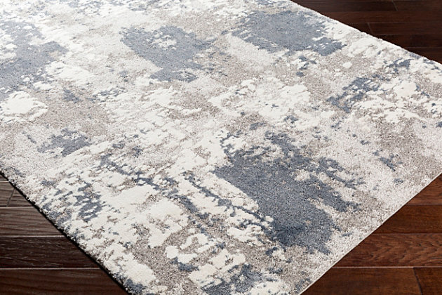 With a soft feel and stunning design, this rug will be the highlight of any room. Its abstract pattern is woven together by neutral yet impactful colors and features textured pile giving it depth. Woven in Turkey with polypropylene, this plush, cozy piece will bring both glamour and comfortable warmth to your floors.Machine Woven | 100% Polypropylene | Easy Care | No Shedding | Imported