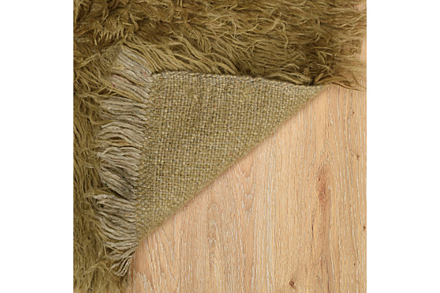 There is only one real Flokati, and still today, Flokati is one of the few products made the same way and in the same place as they were for centuries. Hand Woven in Greece of 100% New Zealand Wool the Original Flokati area rugs are a masterpiece for any home.A rug pad is recommended because it has no substantial backing. A rug pad is recommended because it has no substantial backing.Imported | Hand woven shag | 100% wool with a 100% wool open woven back | Vacuum regularly with suction only, disengage the beater bar.  spot clean with damp cloth and mild detergent.  rug can be washed in industrial sized machine with mild detergent such as dreft.  do not place in dryer, lay flat to dry, wool will then revert to curly nature and can be taken outside to shake and brished thru with a wide tooth vent style brush.  professional cleaning recommended.