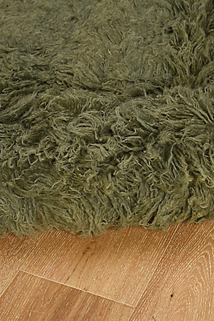 There is only one real Flokati, and still today, Flokati is one of the few products made the same way and in the same place as they were for centuries. Hand Woven in Greece of 100% New Zealand Wool the Original Flokati area rugs are a masterpiece for any home. Combining unique colorations with a truly unique construction, these pieces are a must have in any home looking for style, design and a classic piece of floor art.A rug pad is recommended because it has no substantial backing. A rug pad is recommended because it has no substantial backing.Imported | Hand woven shag | 100% wool with a 100% wool open woven back | Vacuum regularly with suction only, disengage the beater bar.  spot clean with damp cloth and mild detergent.  rug can be washed in industrial sized machine with mild detergent such as dreft.  do not place in dryer, lay flat to dry, wool will then revert to curly nature and can be taken outside to shake and brished thru with a wide tooth vent style brush.  professional cleaning recommended.