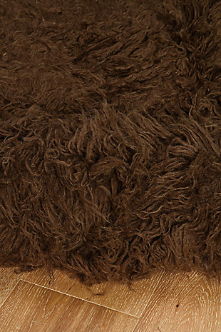 There is only one real Flokati, and still today, Flokati is one of the few products made the same way and in the same place as they were for centuries. Hand Woven in Greece of 100% New Zealand Wool the Original Flokati area rugs are a masterpiece for any home.A rug pad is recommended because it has no substantial backing. A rug pad is recommended because it has no substantial backing.Imported | Hand Woven Shag | 100% Wool with a 100% Wool Open Woven Back | Vacuum regularly with suction only, disengage the beater bar.  Spot clean with damp cloth and mild detergent.  Rug can be washed in industrial Sized Machine with mild detergent such as Dreft.  Do NOT place in dryer, lay flat to dry, wool will then revert to curly nature and can be taken outside to shake and brished thru with a wide tooth vent style brush.  Professional cleaning recommended.