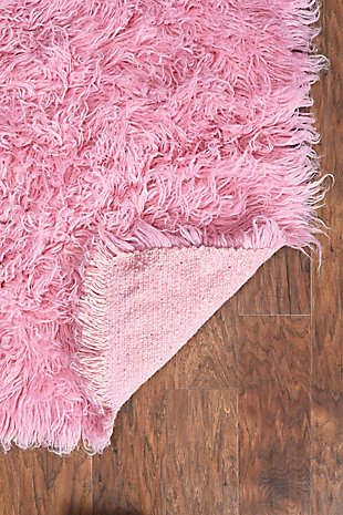 There is only one real Flokati, and still today, Flokati is one of the few products made the same way and in the same place as they were for centuries. Hand Woven in Greece of 100% New Zealand Wool the Original Flokati area rugs are a masterpiece for any home. Combining unique colorations with a truly unique construction, these pieces are a must have in any home looking for style, design and a classic piece of floor art.A rug pad is recommended because it has no substantial backing. A rug pad is recommended because it has no substantial backing.Imported | Hand woven shag | 100% wool with a 100% wool open woven back | Vacuum regularly with suction only, disengage the beater bar.  spot clean with damp cloth and mild detergent.  rug can be washed in industrial sized machine with mild detergent such as dreft.  do not place in dryer, lay flat to dry, wool will then revert to curly nature and can be taken outside to shake and brished thru with a wide tooth vent style brush.  professional cleaning recommended.
