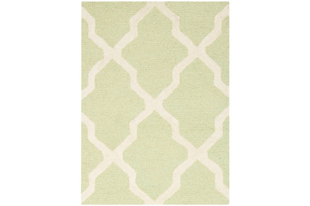 Freshen your living room, dining room, bedroom or entryway with the Safavieh Cambridge area rug, featuring an over-scaled Moroccan motif inspired by centuries-old artisan tile floors. Hand-tufted of superior wool for softness and durability, this simple but striking rug pairs different pile styles for interesting texture and dimension.Made of wool | Hand-tufted | Cotton backing; rug pad recommended | Wool fibers are prone to shedding, vacuum regularly and shedding will subside | Imported | Spot clean/dry clean recommended