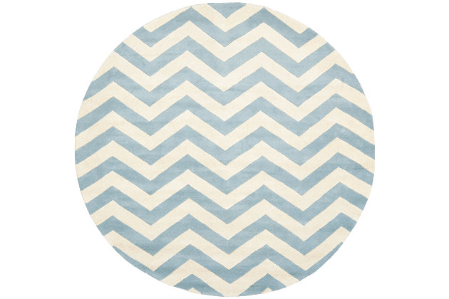 With its trendy chevron pattern, this Safavieh kids round rug is buzzing with possibilities. Rest assured, it’s got a hand-tufted wool pile quality crafted for years of enjoyment and a cool, contemporary style they won’t soon outgrow.Made of wool | Hand-tufted | Rug pad recommended | Wool fibers are prone to shedding, vacuum regularly and shedding will subside | Imported | Spot clean/dry clean recommended