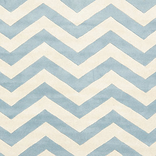 With its trendy chevron pattern, this Safavieh kids round rug is buzzing with possibilities. Rest assured, it’s got a hand-tufted wool pile quality crafted for years of enjoyment and a cool, contemporary style they won’t soon outgrow.Made of wool | Hand-tufted | Rug pad recommended | Wool fibers are prone to shedding, vacuum regularly and shedding will subside | Imported | Spot clean/dry clean recommended