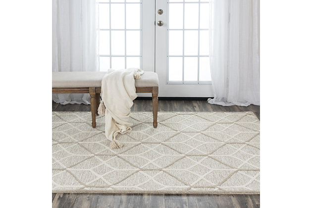 A masterpiece of great design, stunning color and skilled craftsmanship, this large area rug is part of the Ava collection. Skilled artisans create works of art with tuft looped color fields of soft, solid colored wool and overlay crisp, geometric patterns. The design accents are hand sheared at a slightly taller height, creating 3-D effects that makes the designs literally jump out. 100% Wool | Hand Tufted | Unique designs | Exclusive design