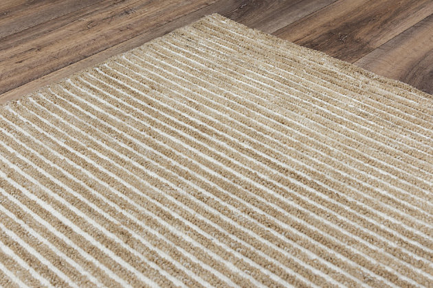 The tufted area rugs in the Vista collection feature three unique patterns, each available in on-trend fashion colors. Made of 100% recycled water bottles, the rugs bring a unique touch to any indoor or outdoor space. This medium-sized area rug has a light, neutral hue that could be the perfect addition for your home.100% Recycled Polyester | Hand Tufted | Unique designs | Exclusive design