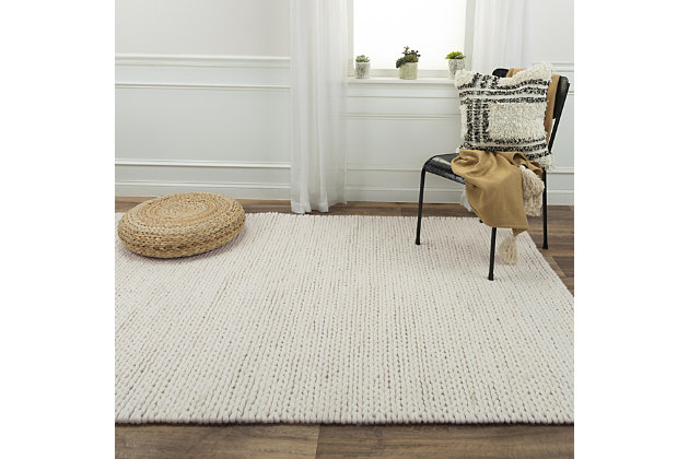 Part of the Kolkata collection, this medium-size area rug features natural fibers hand-woven together to create the perfect rug. It is available in two different patterns with soft, neutral colors that allow it to blend beautifully into any area of your home. Thick Wool | Hand Woven | Unique designs | Exclusive design
