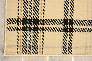 A perfect plaid design is especially eye-catching when presented in cosmopolitan shades of cream and black. Expertly power-loomed from from fabulously textured polypropylene, this entrancing grafix area rug from nourison will artfully accentuate any room.Serged edges | Easy-care fibers | Cut pile | Machine made | Power-loomed | Low shedding | Recommended for areas with moderate foot traffic | Indoor only | 100% polypropylene | Imported