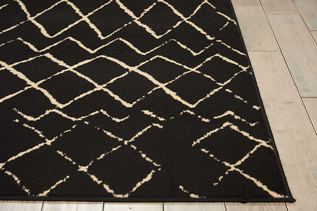 Playful and primitive, this grafix area rug from nourison features distressed cream-colored tribal rug patterns on a sumptuous black field. Each rug is power-loomed for simple care, superior wear and a splendid look and feel, and will transform even the most ordinary room into something extraordinary.Serged edges | Easy-care fibers | Cut pile | Machine made | Power-loomed | Low shedding | Recommended for areas with moderate foot traffic | Indoor only | 100% polypropylene | Imported