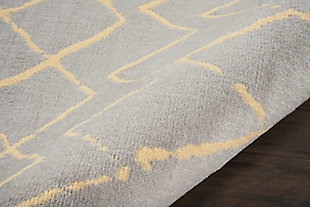 Playful and primitive, this grafix area rug from nourison features distressed cream-colored tribal rug patterns on a luxurious grey field. Each rug is power-loomed for simple care, superior wear, and a splendid look and feel, and will transform even the most ordinary room into something extraordinary.Serged edges | Easy-care fibers | Cut pile | Machine made | Power-loomed | Low shedding | Recommended for areas with moderate foot traffic | Indoor only | 100% polypropylene | Imported