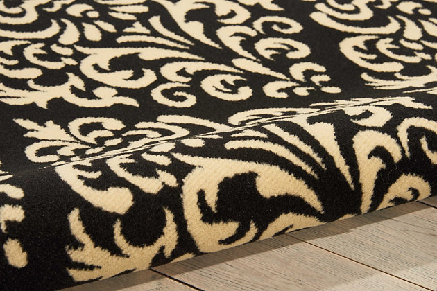 A damask design takes a daring turn when it lines up with glamorous, geometric precision and is displayed in statement-making shades of black and cream. Power loomed from a marvelously enduring yet supremely soft 100% polypropylene for long wear and low maintenance, this grafix area rug from nourison will lend a dash of drama to any room.Serged edges | Easy-care fibers | Cut pile | Machine made | Power-loomed | Low shedding | Recommended for areas with moderate foot traffic | Indoor only | 100% polypropylene | Imported