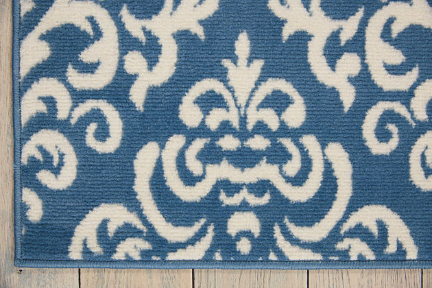 Damask design takes elegance to another level with glamorous, geometric precision of ornate white patterns on a regal blue field. Power loomed for long wear and low maintenance, this grafix area rug from nourison will lend a dash of drama to any room.Serged edges | Easy-care fibers | Cut pile | Machine made | Power-loomed | Low shedding | Recommended for areas with moderate foot traffic | Indoor only | 100% polypropylene | Imported
