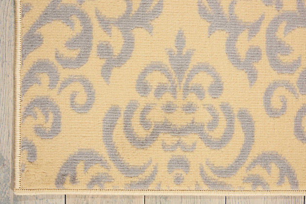 Damask design takes a daring turn in cream color when it lines up with glamorous, geometric precision in cream and grey. Power loomed for long wear and low maintenance, this grafix area rug from nourison will lend a dash of drama to any room.Serged edges | Easy-care fibers | Cut pile | Machine made | Power-loomed | Low shedding | Recommended for areas with moderate foot traffic | Indoor only | 100% polypropylene | Imported