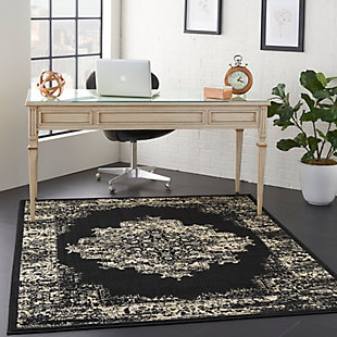 In intriguing shades of black and cream this brilliantly-bordered, central medallion Grafix area rug from Nourison will elevate the elegance quotient of any room. Masterfully power loomed for a lavish feel, long wear and low maintenance.Serged Edges | Easy-care fibers | Cut pile | Machine made | Power-loomed | Low shedding | Recommended for areas with moderate foot traffic | Indoor only | 100% Polypropylene | Imported | Backing: latex | Rug pad recommended | Vacuum regularly, clean spills immediately by blotting with a clean sponge or cloth. Professional cleaning recommended.