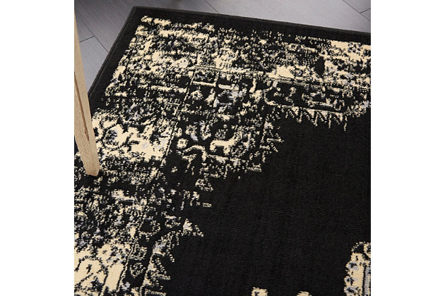 In intriguing shades of black and cream this brilliantly-bordered, central medallion Grafix area rug from Nourison will elevate the elegance quotient of any room. Mastery power loomed for a lavish feel, long wear and low maintenance.Serged Edges | Easy-care fibers | Cut pile | Machine made | Power-loomed | Low shedding | Recommended for areas with moderate foot traffic | Indoor only | 100% Polypropylene | Imported