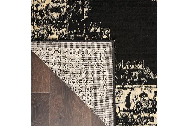 In intriguing shades of black and cream this brilliantly-bordered, central medallion Grafix area rug from Nourison will elevate the elegance quotient of any room. Masterfully power loomed for a lavish feel, long wear and low maintenance.Serged Edges | Easy-care fibers | Cut pile | Machine made | Power-loomed | Low shedding | Recommended for areas with moderate foot traffic | Indoor only | 100% Polypropylene | Imported | Backing: latex | Rug pad recommended | Vacuum regularly, clean spills immediately by blotting with a clean sponge or cloth. Professional cleaning recommended.