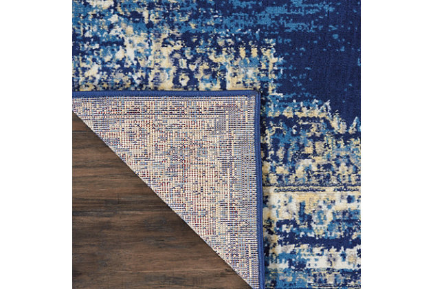 In intriguingly distressed shades of blue and white, this Grafix area rug from Nourison will elevate the elegance quotient of any room. Each rug is brilliantly bordered in traditional Persian rug style, and masterfully power loomed for a lavish feel, long wear, and low maintenance.Serged Edges | Easy-care fibers | Cut pile | Machine made | Power-loomed | Low shedding | Recommended for areas with moderate foot traffic | Indoor only | 100% Polypropylene | Imported | Backing: latex | Rug pad recommended | Vacuum regularly, clean spills immediately by blotting with a clean sponge or cloth. Professional cleaning recommended.