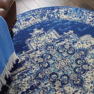 In intriguingly distressed shades of blue and white, this Grafix area rug from Nourison will elevate the elegance quotient of any room. Each rug is brilliantly bordered in traditional Persian rug style, and masterfully power loomed for a lavish feel, long wear, and low maintenance.Serged Edges | Easy-care fibers | Cut pile | Machine made | Power-loomed | Low shedding | Recommended for areas with moderate foot traffic | Indoor only | 100% Polypropylene | Imported