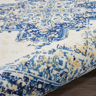 In intriguingly distressed shades of navy blue and white, this Grafix area rug from Nourison will elevate the elegance quotient of any room. Each rug is brilliantly bordered in traditional Persian rug style, and masterfully power loomed for a lavish feel, long wear, and low maintenance.Serged Edges | Easy-care fibers | Cut pile | Machine made | Power-loomed | Low shedding | Recommended for areas with moderate foot traffic | Indoor only | 100% Polypropylene | Imported | Backing: latex | Rug pad recommended | Vacuum regularly, clean spills immediately by blotting with a clean sponge or cloth. Professional cleaning recommended.