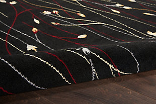 This grafix area rug from nourison features a gracefully flowing floral design in spectacular shades of black, crimson, cream and blue to impart a stunning sophisticated simplicity to any room where it resides.Serged edges | Easy-care fibers | Cut pile | Machine made | Power-loomed | Low shedding | Recommended for areas with moderate foot traffic | Indoor only | 100% polypropylene | Imported