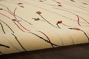 This grafix area rug from nourison features a graceful floral design in spectacular shades of black, red, cream, and blue on an elegant cream-colored field to impart a stunning sophistication to any room where it resides.Serged edges | Easy-care fibers | Cut pile | Machine made | Power-loomed | Low shedding | Recommended for areas with moderate foot traffic | Indoor only | 100% polypropylene | Imported