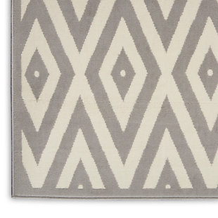 Concentric diamonds dazzle the eye in this boldly contemporary rug from the Grafix Collection by Nourison. The white-on-grey patterns are a mesmerizing addition to any room where you want to inject additional energy and sense of movement.Serged edges | Easy-care fibers | Cut pile | Machine made | Power-loomed | Low shedding | Recommended for areas with moderate foot traffic | Indoor only | 100% Polypropylene | Imported | Backing: latex | Rug pad recommended | Vacuum regularly, clean spills immediately by blotting with a clean sponge or cloth. Professional cleaning recommended.