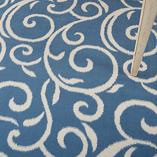 Curling vines form a lush abstract garden in this grafix collection area rug. This botanical style rug features ivory patterns on a soft blue field, with voluptuous curves creating a statement of soft comfort with artistic flair.Serged edges | Easy-care fibers | Cut pile | Machine made | Power-loomed | Low shedding | Recommended for areas with moderate foot traffic | Indoor only | 100% polypropylene | Imported