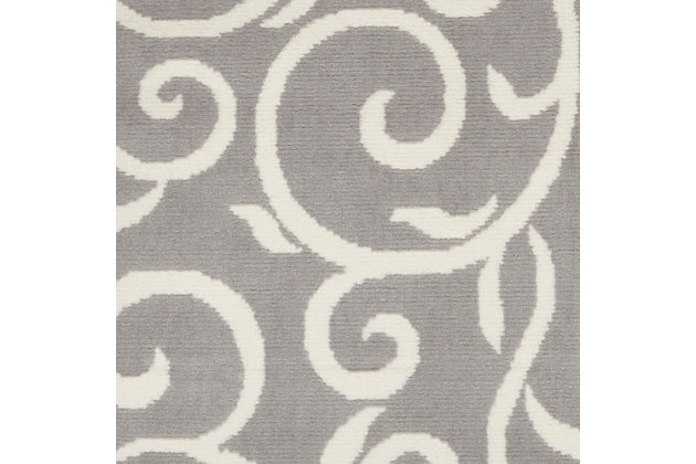 Curling vines form a lush abstract garden in this grafix collection area rug. This botanical style rug features ivory patterns on a soft grey field, with voluptuous curves creating a statement of soft comfort with artistic flair.Serged edges | Easy-care fibers | Cut pile | Machine made | Power-loomed | Low shedding | Recommended for areas with moderate foot traffic | Indoor only | 100% polypropylene | Imported