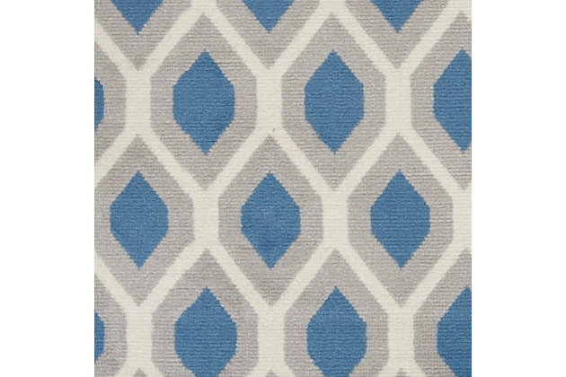 The hexagon-themed repeat pattern of this grafix area rug creates a dimensional op-art look that draws the eye and pulls a room together. The combination of muted blue, beige and ivory creates a subtle yet stunning focal point for the contemporary home.Serged edges | Easy-care fibers | Cut pile | Machine made | Power-loomed | Low shedding | Recommended for areas with moderate foot traffic | Indoor only | 100% polypropylene | Imported