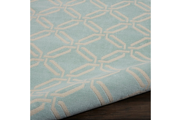 This bold and eclectic round rug from the jubilant collection features a contemporary interlocking trellis design, making a statement of classic chic in ivory on aqua. Sleek, low-pile construction from easy-care fibers lets you bring extra energy and excitement anywhere in the home.Easy-care fibers | Low pile construction | Cut pile | Machine made | Power-loomed | Low shedding | Recommended for areas with moderate foot traffic | Indoor only | 100% polypropylene | Imported