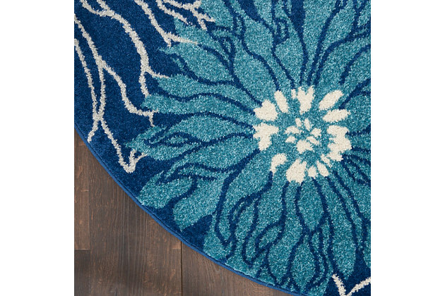 Bold is beautiful in this lush, modern floral design from the passion collection. Its oversize, imaginative blooms practically burst the serged-edges of this area rug. A rich and seductive look in magnificent blues and ivory, enhanced with cut pile for superb dimension and texture.Easy-care fibers | Excellent value | Medium pile | Machine made | Power-loomed | Low shedding | Recommended for areas with moderate foot traffic | Indoor only | 100% polypropylene | Imported